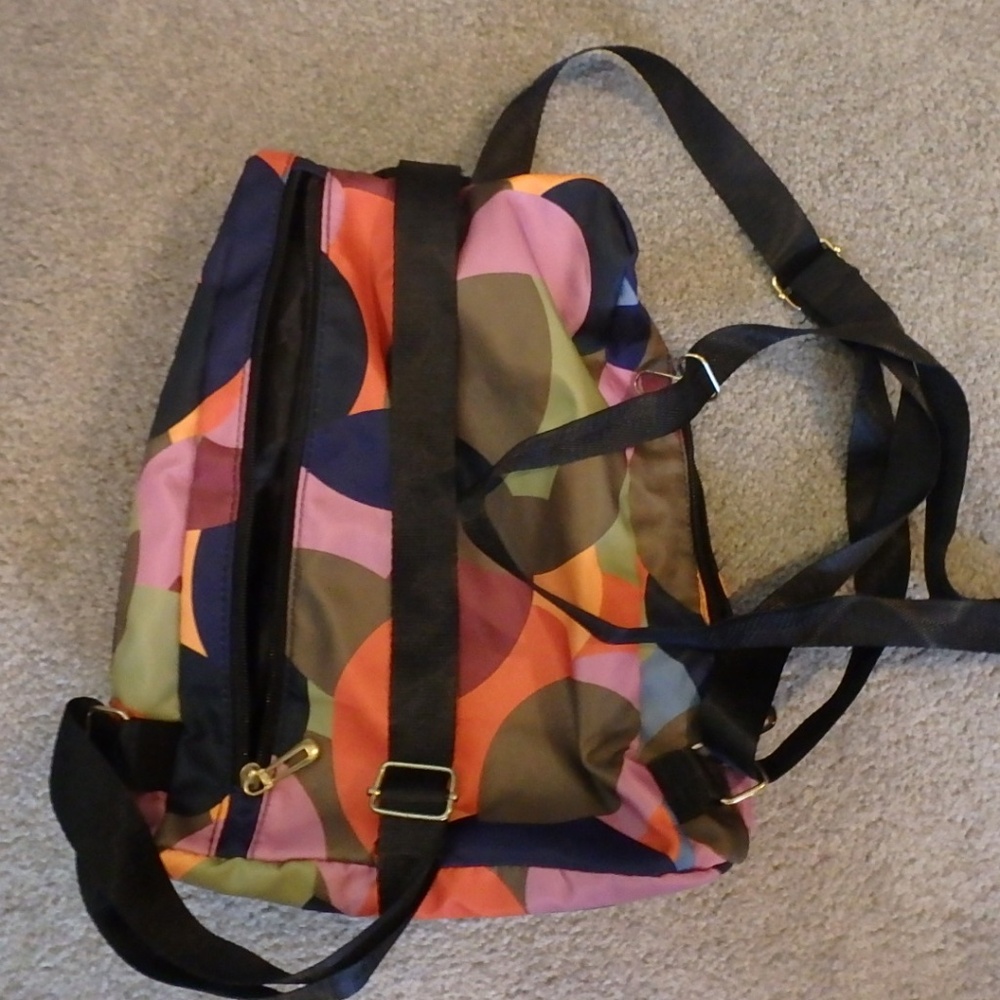 Nylon backpack with two additional bags in vibrant polka dots!